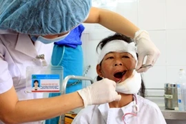 Trên 90% người bị viêm lợi, viêm quanh răng. (Ảnh: Dương Ngọc/TTXVN)