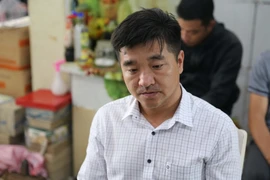 Ông Nguyễn Mạnh Nghĩa sau khi bị bắt. (Ảnh: TTXVN phát)