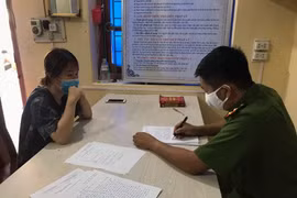 Chị L.T.H tại cơ quan công an. (Ảnh: TTXVN phát)