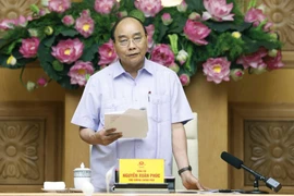 Thủ tướng Nguyễn Xuân Phúc chủ trì họp Ban Chỉ đạo cơ cấu lại hệ thống các tổ chức tín dụng. (Ảnh: Thống Nhất/TTXVN)