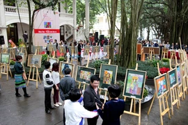 Toàn cảnh buổi triển lãm sáng 8/3. (Ảnh: Doãn Đức/Vietnam+)