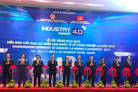 Lễ cắt băng khai mạc triển lãm quốc tế về công nghiệp, ngày 13/7. (Ảnh: PV/Vietnam+)