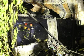 Hiện trường vụ cháy tại ngôi nhà số 77 đường Nguyễn Trãi, phường 9, thành phố Cà Mau. (Ảnh: Huỳnh Thế Anh/TTXVN)