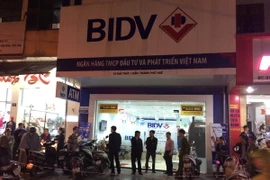 Chi nhánh ngân hàng BIDV bị cướp. (Ảnh Hồ Cầu/TTXVN)