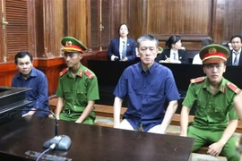 Các bị cáo tại phiên toà sơ thẩm. (Ảnh: Trần Xuân Tình/TTXVN)