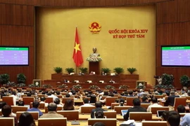 Đại biểu Quốc hội biểu quyết thông qua Luật chứng khoán (sửa đổi). (Ảnh: Doãn Tấn/TTXVN)