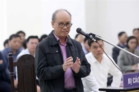 Bị cáo Trần Văn Minh trả lời các câu hỏi của luật sư bào chữa trong phiên xét xử ngày 5/1. (Ảnh: Doãn Tấn/TTXVN)