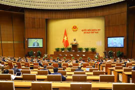 Bộ trưởng Bộ Lao động, Thương binh - Xã hội Đào Ngọc Dung trình bày Báo cáo tình hình thực hiện chính sách, chế độ bảo hiểm xã hội, quản lý và sử dụng Quỹ bảo hiểm xã hội năm 2020. (Ảnh: Văn Điệp/TTXVN)
