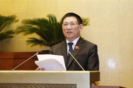 Bộ trưởng Bộ Tài chính Hồ Đức Phớc trình bày Tờ trình về dự án Luật Kinh doanh bảo hiểm (sửa đổi). (Ảnh: Doãn Tấn/ TTXVN)
