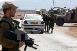 Binh sỹ Israel tại một trạm kiểm tra an ninh. (Nguồn: AFP/TTXVN)