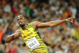 Usain Bolt vừa đăng quang tại Giải vô địch điền kinh thế giới ở Bắc Kinh. (Ảnh: AFP)