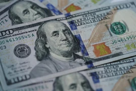 Đồng tiền USD tại Washington D.C. (Ảnh: THX/TTXVN)