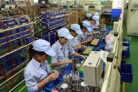 Hoạt động sản xuất tại Công ty TNHH Công nghiệp Minda Việt Nam (khu công nghiệp Bình Xuyên). (Ảnh: Hoàng Hùng/TTXVN)