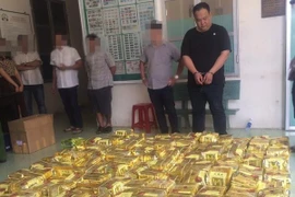 Tang vật và các đối tượng bị lực lượng công an TP. Hồ Chí Minh bắt giữ. (Nguồn: Cổng thông tin điện tử Công an TP.HCM)
