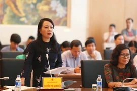 Bộ trưởng Bộ Y tế Nguyễn Thị Kim Tiến trình bày báo cáo giải trình về chất lượng và hiệu quả của mạng lưới y tế cơ sở. (Ảnh: TTXVN)