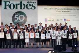Tạp chí Forbes Việt Nam vinh danh 50 công ty niêm yết tốt nhất năm 2014. (Ảnh: Hoàng Hải/TTXVN)