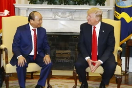 Thủ tướng Nguyễn Xuân Phúc và Tổng thống Hợp chúng quốc Hoa Kỳ Donald Trump. (Ảnh: Thống Nhất/TTXVN)