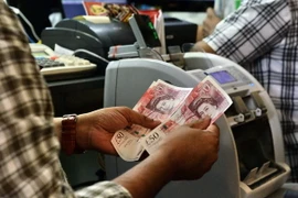 Đồng bảng Anh sụt giá kỷ lục sau "cú sốc" Brexit. (Nguồn: AFP/TTXVN)