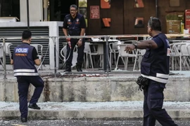 Cảnh sát Malaysia điều tra tại hiện trường một vụ tấn công. (Nguồn: EPA/TTXVN)
