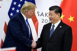 Tổng thống Mỹ Donald Trump (trái) và Chủ tịch Trung Quốc Tập Cận Bình tại cuộc gặp ở thành phố Osaka, Nhật Bản ngày 28/6/2019. (Nguồn: AFP/TTXVN) 