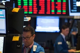 Giao dịch viên tại Sàn giao dịch chứng khoán New York, Mỹ ngày 8/8. (Nguồn: AFP/TTXVN)