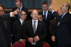 Bộ trưởng Tài chính Đức Olaf Scholz (giữa) tại hội nghị ngày 19/3. (Nguồn: AFP/TTXVN)