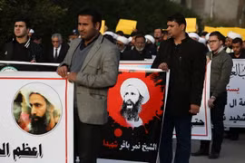 Biểu tình tại thủ đô Baghdad, Iraq, phản đối quyết định xử tử giáo sỹ Nimr al-Nimr ngày 3/1. (Nguồn: AFP/TTXVN)