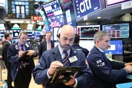 Các giao dịch viên tại sàn chứng khoán New York ngày 22/3. (Nguồn: THX/TTXVN)