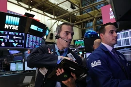 Giao dịch viên tại Sàn giao dịch chứng khoán New York, Mỹ ngày 16/11. (Nguồn: AFP/TTXVN)