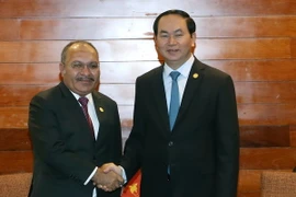 Chủ tịch nước Trần Đại Quang tiếp Thủ tướng Papua New Guinea Peter O’ Neill trong khuôn các hoạt động của Tuần lễ Cấp cao APEC lần thứ 24 tại Peru, sáng 19/11/2016. (Ảnh: Nhan Sáng/TTXVN)