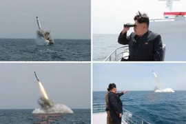 Nhà lãnh đạo Triều Tiên Kim Jong-Un theo dõi một vụ phóng thử tên lửa từ tàu ngầm. (Nguồn: ​Getty Images/TTXVN)