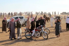 Người dân Syria vui mừng chiến thắng tại Aleppo ngày 12/5. (Nguồn: AFP/TTXVN)