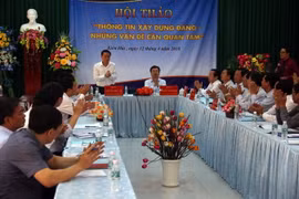 Tổng giám đốc TTXVN Nguyễn Đức Lợi và Bí thư Tỉnh ủy Kiên Giang Nguyễn Thanh Nghị đồng chủ trì hội thảo. (Ảnh: Lê Sen/TTXVN)