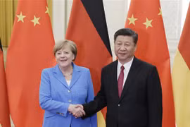 Chủ tịch Trung Quốc Tập Cận Bình và Thủ tướng Đức Angela Merkel. (Nguồn: AFP) 