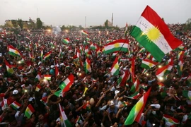 Cộng đồng người Kurd ở Iraq tuần hành kêu gọi người dân tham gia cuộc trưng cầu dân ý về độc lập tại thủ phủ Arbil ngày 16/9. (Nguồn: AFP/TTXVN)