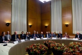 Các đại biểu tham giam cuộc đàm phán hạt nhân tại Palais des Nations ở thủ đô Geneva, Thụy Sĩ ngày 24/11. (Nguồn: THX/TTXVN)