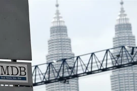 Logo Quỹ 1MDB tại điểm giao dịch ngoại hối Tun Razak ở Kuala Lumpur ngày 8/7/2015. (Nguồn: AFP/TTXVN) 