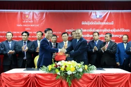 Lễ ký Biên bản thỏa thuận hợp tác giữa Ban Tuyên giáo hai nước giai đoạn 2016-2021. (Ảnh: Phạm Kiên/TTXVN)