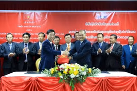 Lễ ký Biên bản thỏa thuận hợp tác giữa Ban Tuyên giáo hai nước giai đoạn 2016-2021. (Ảnh: Phạm Kiên/TTXVN)