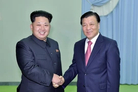 Ông Lưu Vân Sơn trong cuộc gặp với ông Kim Jong-Un. (Nguồn: THX/TTXVN)