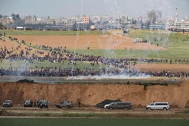 Xung đột giữa binh sỹ Israel và người biểu tình Palestine tại Dải Gaza ngày 30/3. (Nguồn: THX/TTXVN)