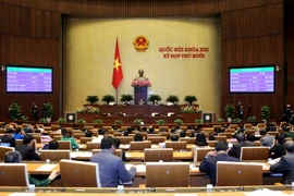 Quốc hội biểu quyết thông qua toàn văn Luật tổ chức cơ quan điều tra hình sự. (Ảnh: Phương Hoa/TTXVN)