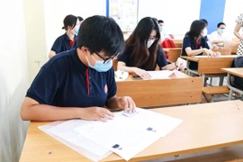 Thí sinh dự thi tốt nghiệp trung học phổ thông năm 2020, lấy kết quả xét tuyển vào các trường đại học. (Ảnh: PV/Vietnam+)
