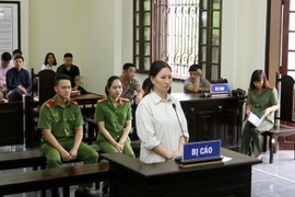 Bị cáo Lê Thị Huệ tại buổi xét xử sơ thẩm. (Ảnh: Quốc Khánh/TTXVN)