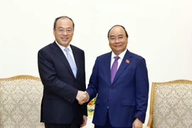 Thủ tướng Nguyễn Xuân Phúc tiếp ông Nguyễn Thành Phát, Tỉnh trưởng Vân Nam, Trung Quốc. (Ảnh: Thống Nhất/TTXVN)