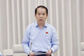 Chủ nhiệm Ủy ban Pháp luật của Quốc hội Hoàng Thanh Tùng trình bày báo cáo. (Ảnh: Doãn Tấn/TTXVN)