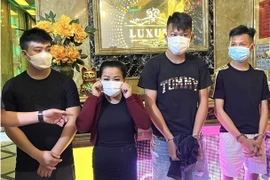 Các đối tượng (từ trái qua) Lê Văn Hải, Phạm Thị My, Đinh Thanh Tùng và Trần Thanh Danh. (Ảnh : TTXVN phát)