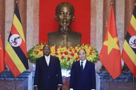 Chủ tịch nước Nguyễn Xuân Phúc và Tổng thống Uganda Yoweri Kaguta Museve. (Ảnh: Thống Nhất/TTXVN)