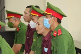 Các bị cáo tại phiên xét xử phúc thẩm. (Ảnh: Bùi Giang/TTXVN)