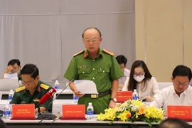 Đại tá Trần Văn Chính, Phó Giám đốc Công an tỉnh Bình Dương cung cấp thông tin tại buổi họp báo. (Ảnh: Chí Tưởng/TTXVN)